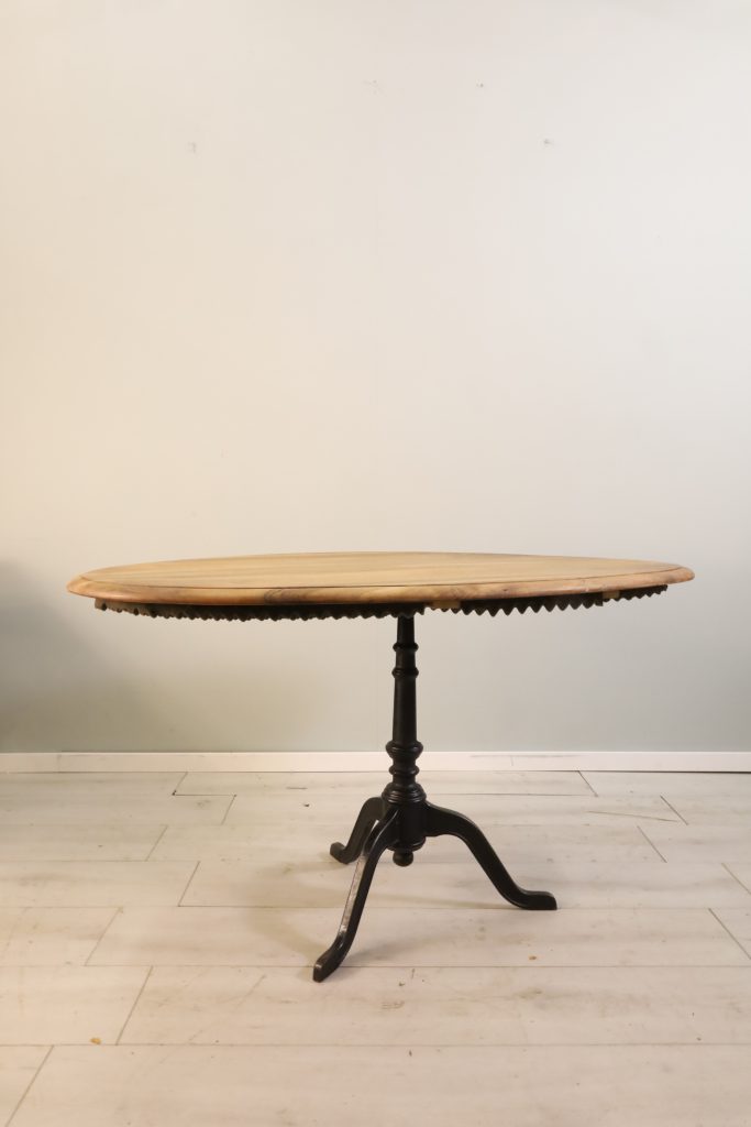 Oval walnut table - with cast iron base - 20th century