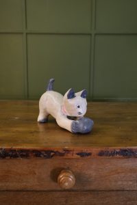 Small wooden cat with play ball