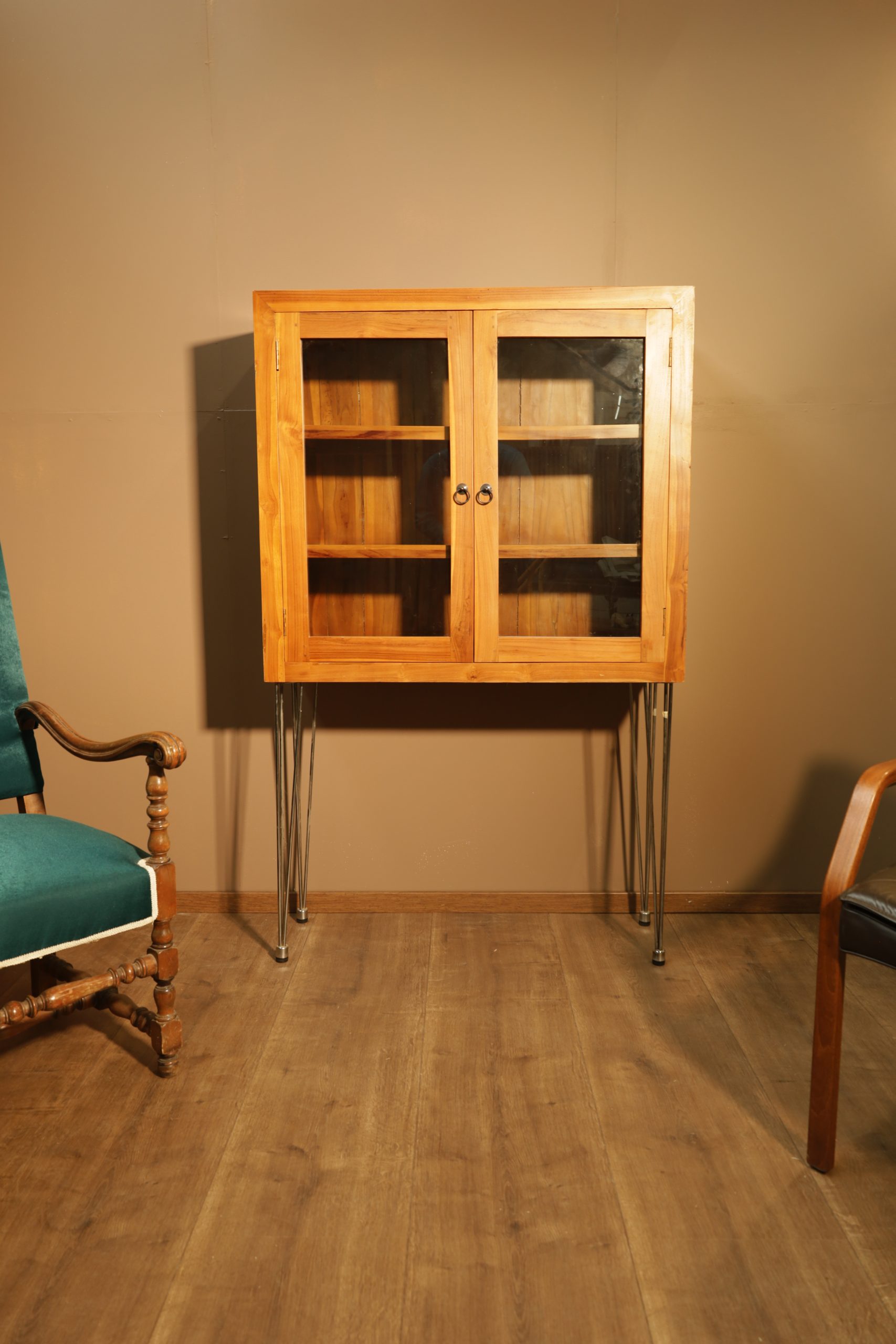 Teak display cabinet on long metal legs